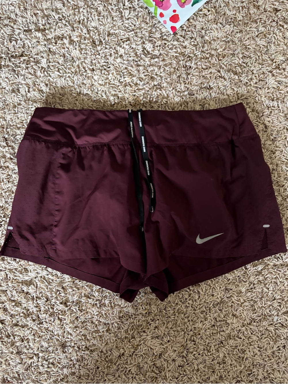 Nike Women's Burgundy Athletic Shorts with Reflective Swoosh
